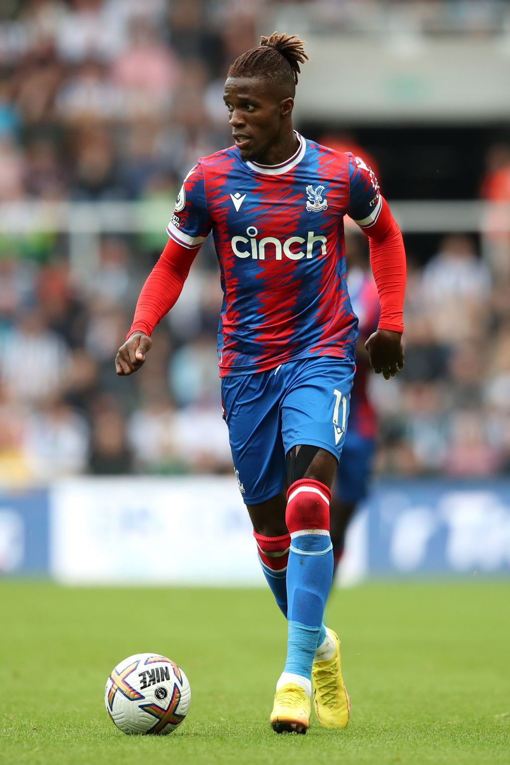 Wilfried-Zaha-of-Crystal-Palace-in-action-during-the-Premier-League-match-between-Newcastle-United-and-Crystal-Palace-at-St.-James-Park
