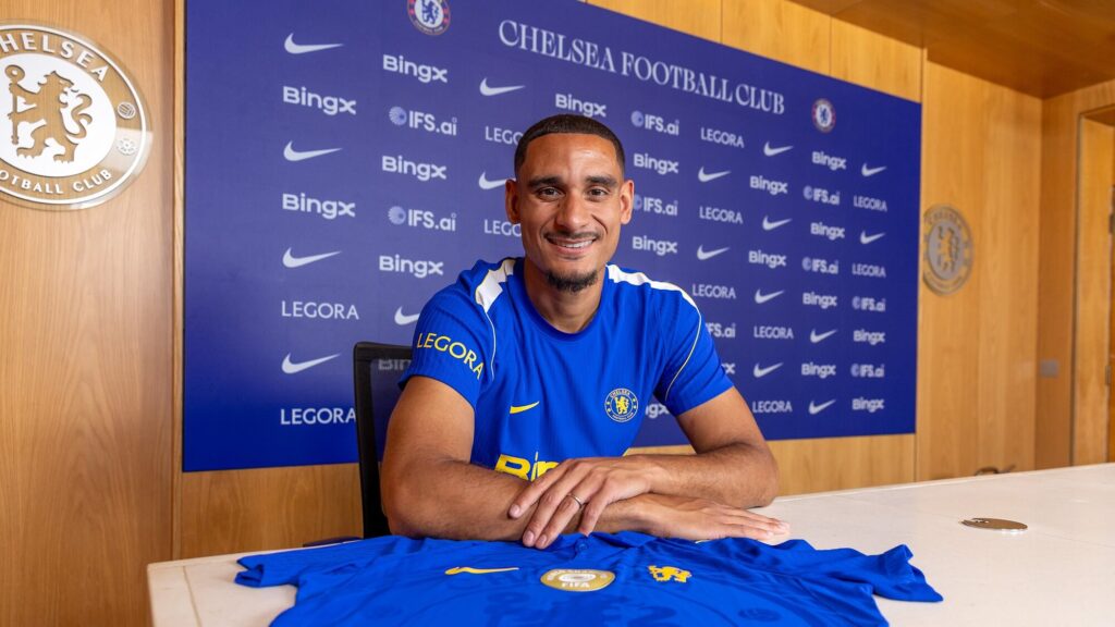 Maxence Lacroix posing in Chelsea kit during his unveiling